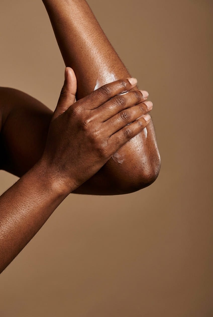 Illustration of lotion being worked into a forearm and elbow